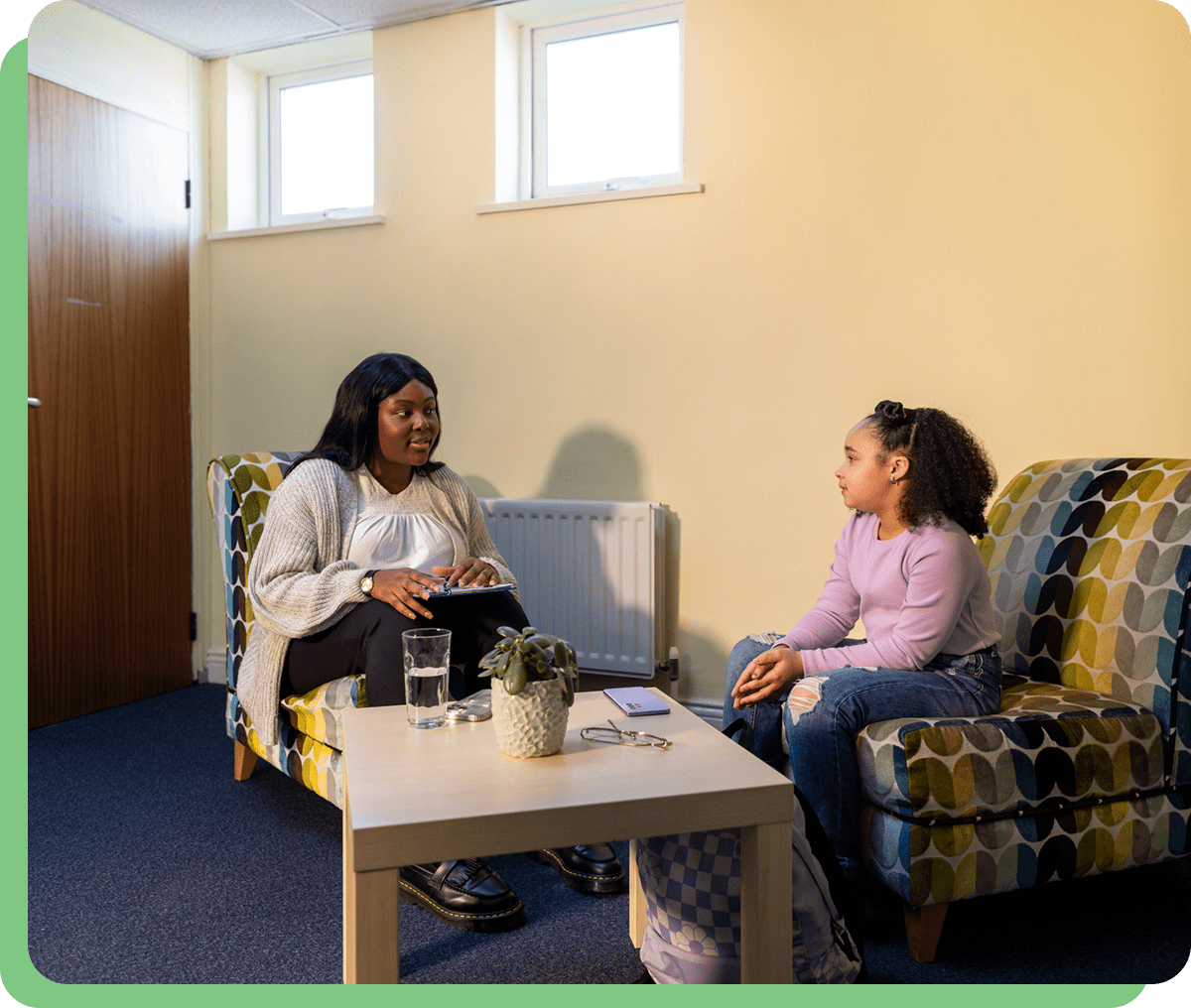 Two people having a conversation in room.